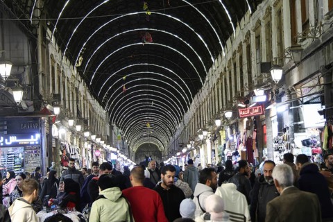 Syrians shop at the historic Al-Hamidiyah Bazaar adjacent to the Umayyad Mosque during the early