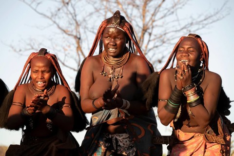 Himba woman dancing euphorically, traditional dance, traditional Himba village, Kaokoveld, Kunene,