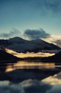 Sunrise with reflections in the Plansee in Tyrol in the Alps in Austria