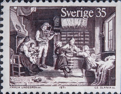 Family Christmas celebration with music and games in 19th century Sweden. Picture on Swedish stamp