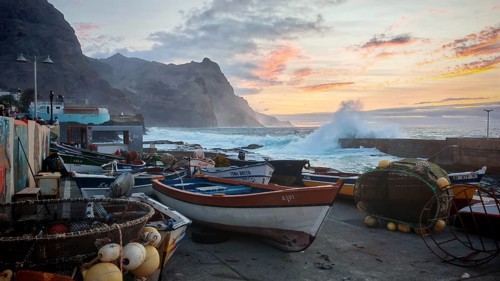 Harbour with fishing boats and big waves at sunset, Ponta do Sol, Santo Antao, Cabo Verde, Cape