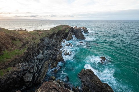 Sunset with wide view over the east coast at Cape Byron, New South Wales, Australia