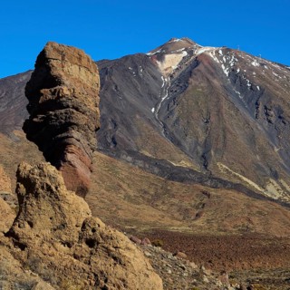 Roques de Garcia, impressive rock formations and the Teide volcano under clear blue sky, Teide,