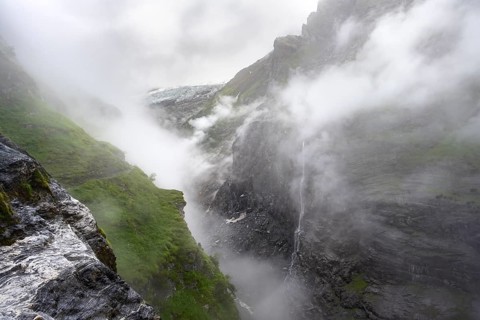 Cloud-covered mystical rock gorge with waterfalls, hike to Berghaus Bäregg, Bernese Alps, Bernese