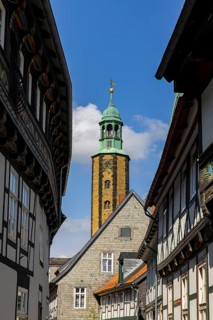 Artful half-timbered houses in the old town with a view of the Goslar Market Church of St Cosmas