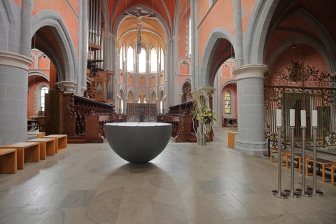 Choir with baptismal font, interior view, Gothic basilica and monastery church built in the 13th