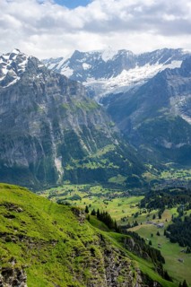 View of mountain landscape and of BGrindelwald, Grindelwald First, snow-capped mountain peaks,