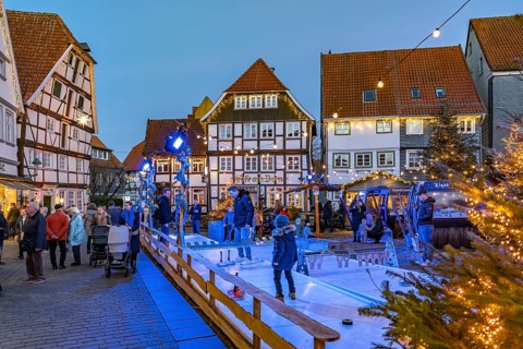 Curling at the Christmas market and timbering in Soest at dusk, North Rhine-Westphalia, Germany