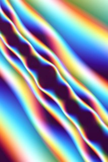 This abstract image features colorful fractal waves flowing seamlessly across the spectrum,