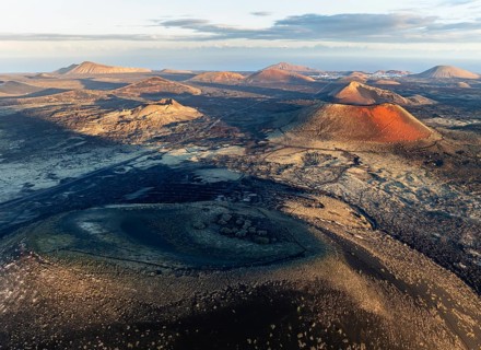 Picturesque volcanic landscape with volcanic craters and lava fields in morning light, Montaña