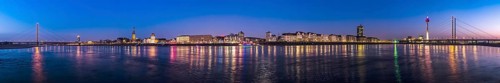 Panorama of the city of Düsseldorf, old town with Rhine bridges and television tower, night shot,