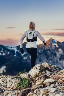 Trail running in autumn on the Jochberg on Lake Walchensee against the wonderful backdrop of the