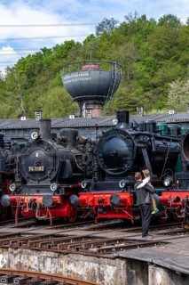 Ring locomotive shed with many historic steam locomotives in the Bochum Railway Museum, museum days
