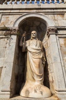 Low angle view of religious statue in recess at Cristo Re Shrine or Rocca Guelfonia fortress,