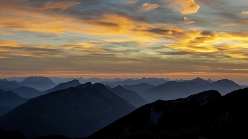 Sunset view from the summit of Zwiesel to Gamsknogel and the Chiemgau Alps with Rauschberg and