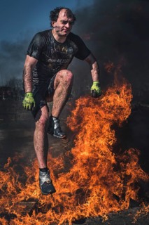 WROCLAW, POLAND - APRIL 7, 2018: Extreme running with obstacle RUNMAGEDDON. In the picture a runner