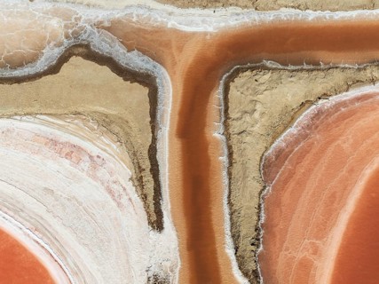 Saline ponds at the Bonanza salt works near Sanlúcar de Barrameda. The reddish colour depends on