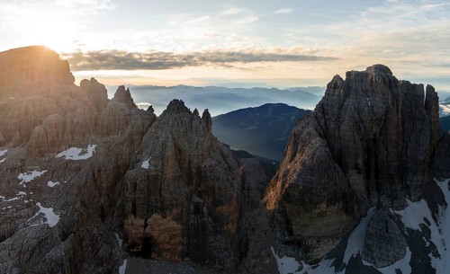 Impressive mountain peaks of the Brenta Mountains, sunrise, 360 degree alpine panorama, aerial