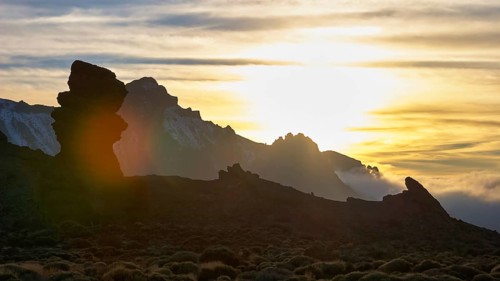Mountain silhouette at sunset against a cloudy sky, Teide, Parque Nacional del Teide, Teide