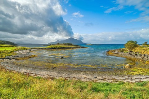 On Litlversvika beach, sea, clouds and blue sky, soft light, Helgeland, Nordland, Arctic Circle,