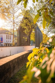 Artistic gate in the municipal park during autumn in the morning, Calw, Black Forest, Germany