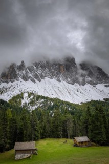 View of a part of the Geisler group in the foreground two mountain huts, Dolomites, snow,
