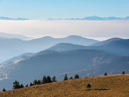 View from the summit of the Belchen (1414m) over the hills of the Black Forest to the Swiss Alps,