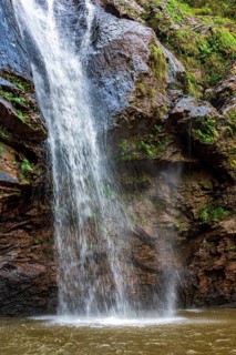 Water from a waterfall splashing between rocks in the state of Minas Gerais, Brazil, Minas Gerais,