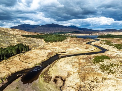 Mountains and Moors over Loch Tulla and River Orchy from a drone, Highlands, Scotland, UK
