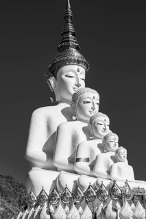 Five-headed Buddha statue, black and white photo, Wat Phra That Sorn Kaew Buddhist temple complex,