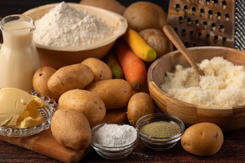 Flour and milk in addition to potatoes, parmesan and carrots