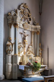 The side altar of the Catholic parish church of St. Johannes Baptist, showing statuesof the saints