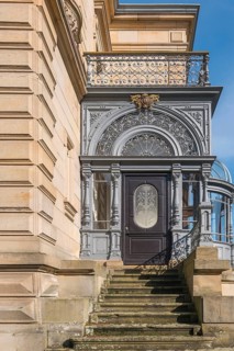Ornate historic door front with staircase and decorative veranda, Landau, Southern Palatinate,