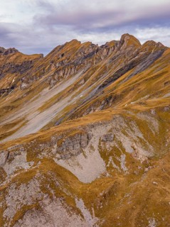 Autumn mountain landscape with barren rocks and cloudy sky, Alpen Tower, Switzerland