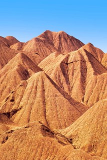 Dramatic details of the eroded orange ridges at Devil's Desert located in Salta, Argentina,