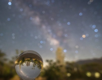 A captivating photo showcasing the Milky Way glittering in the night sky, viewed through a crystal