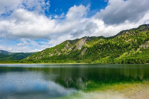 Landscape of Lake Offensee after rain when the sun comes through the clouds in spring,