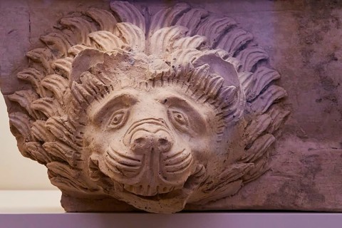 Ancient lion head gargoyle, gargoyle, ancient stone relief of a lion's head shows artistic details,