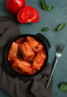Stuffed cabbage rolls in tomato sauce stuffed cabbage leaves, minced meat with rice, on a dark