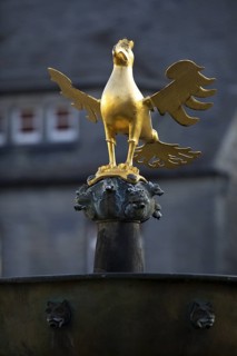 Gilded imperial eagle as a fountain eagle on the market fountain, Old Town, Goslar, UNESCO World