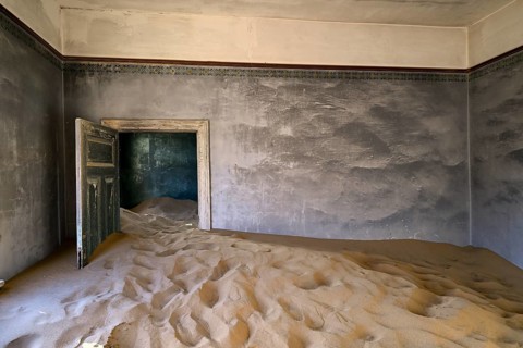 Former dwelling house full of sand, Kolmanskop, restricted diamond area, Karas region, Namibia
