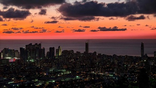 City view at night, illuminated, with red night sky and clouds, Batumi, Georgia