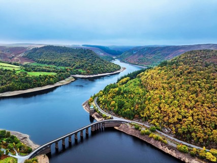 Autumn over Garreg Ddu Dam from a drone, Elan Valley, Caban-Coch Reservoir, Rhayader, Wales, UK