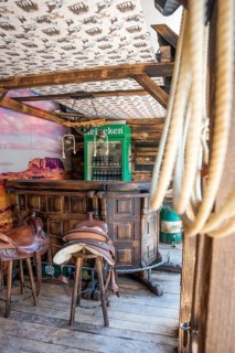 Rustic bar with saddle bar stools and drinks