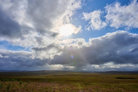 Landscape under dramatic sky with sunbeams and cloud formations, Lairg, Scotland, United Kingdom,