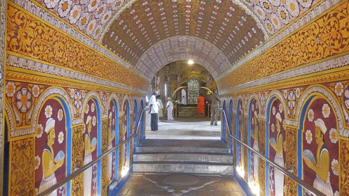 A richly decorated tunnel with painted walls in a temple, Temple of the Tooth, Kandy, Sri Lanka