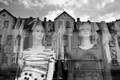 Reflection in a windowpane, women's fashion, Bad Karlshafen, Weser Uplands, Weserbergland, Hesse,