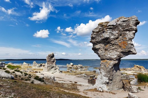 Raukar, limestone pillars, mythical creatures, coastline, Cumulus, uninhabited island of Asunden,