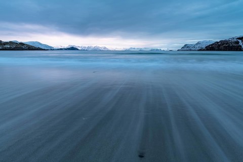 Ocean surf in sandy bay on the Norwegian European Sea at dusk, Söröya, Finnmark, November 2018
