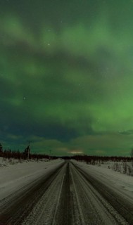 Stunning view of the Aurora Borealis illuminating the night sky with shades of green over a